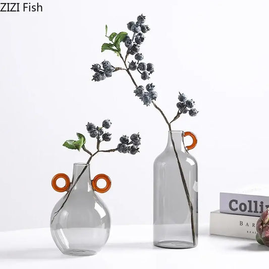 Modern clear glass vase with orange circular handles featuring one rounded and one taller design for living room decorbites clear glass decor