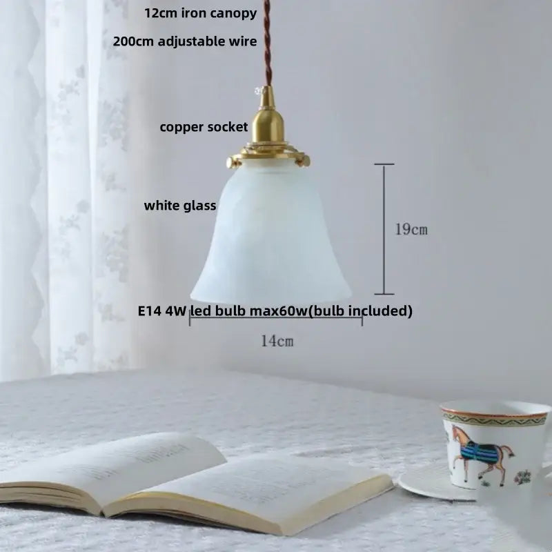 A vintage-style pendant lamp with white frosted glass shade brass copper socket and iron canopy as a glass led pendant lamp