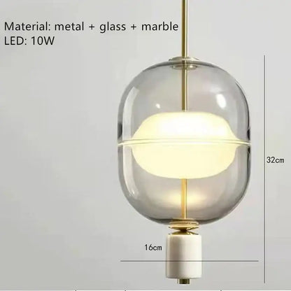Modern clear gray amber pendant light with gold-toned metal accents and white marble base for dining room decorbites clear gray