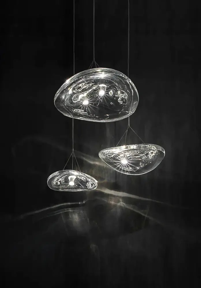 Modern clear patterned glass staircase pendant light featuring translucent glass with intricate internal patterns and bulbs