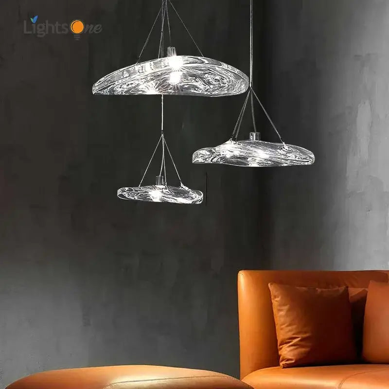 Modern clear hand-blown glass staircase pendant light with swirling organic design for dining room illumination