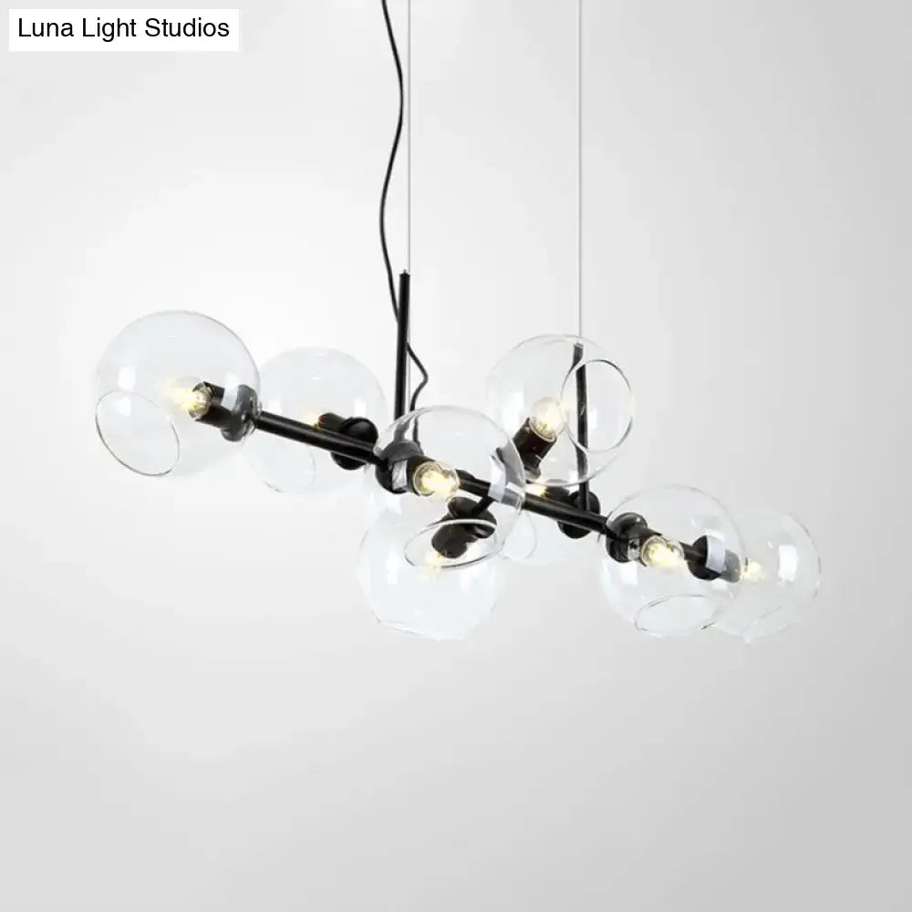 Modern black and gold lighting fixture with clear smoke glass globe bulbs for dining room use