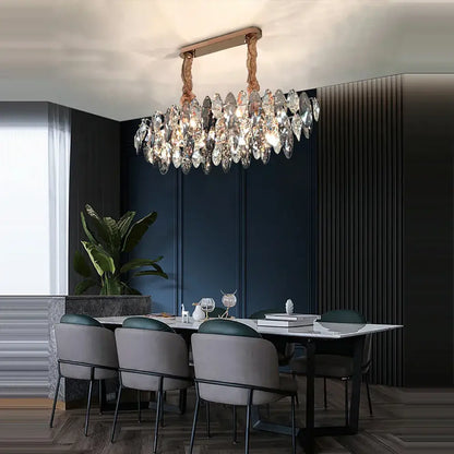 A modern crystal led chandelier with a rose gold frame and clear teardrop pendants for living room decorbites crystal led