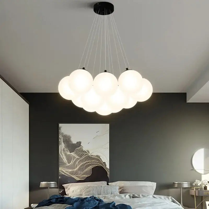 Modern cloud pendant light with multiple frosted glass ball LED spheres suspended from a black ceiling mount for living room decorbites glass ball