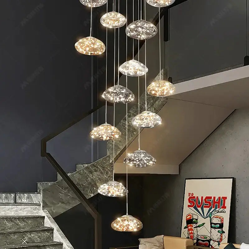 Modern cloud glass crystal pendant chandelier with multiple warm glowing crystal pendants as a dining room focal point
