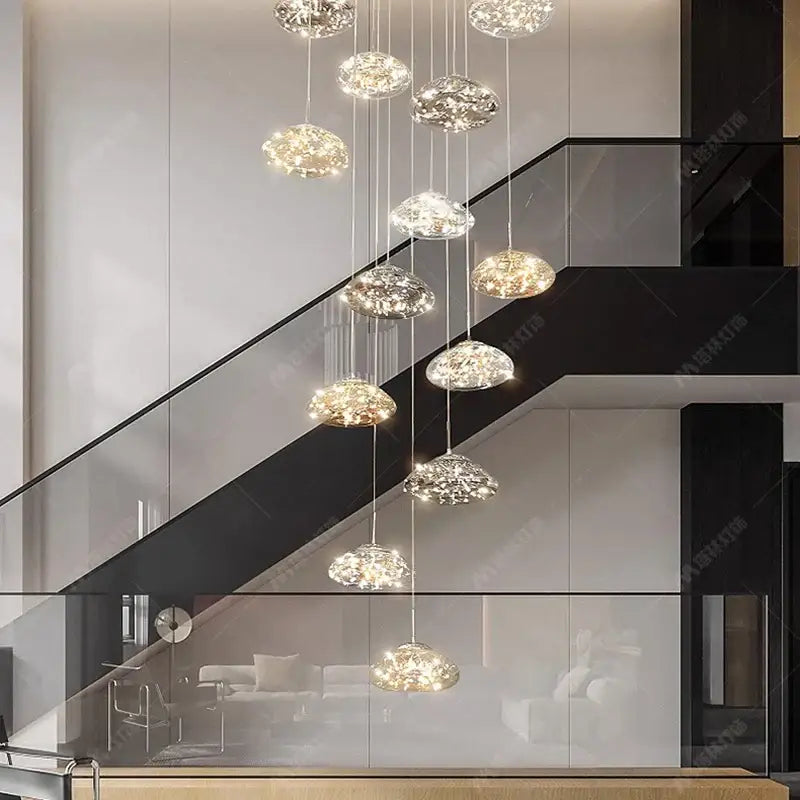 Modern cloud glass crystal pendant chandelier with sparkling warm glowing lights as a dining room focal point