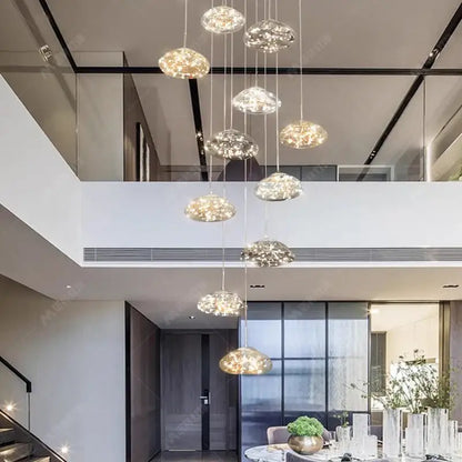 Modern cloud glass crystal pendant chandelier with warm golden lighting serves as a focal point for dining room