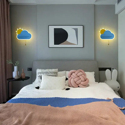 Pastel pink knotted knit pillow with soft textured surface paired with modern decorbites cloud wall lamps for childrens bedroom