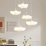Modern cloud white floating pendant light with smooth matte finish hanging from ceiling for dining room decorbites cloud white