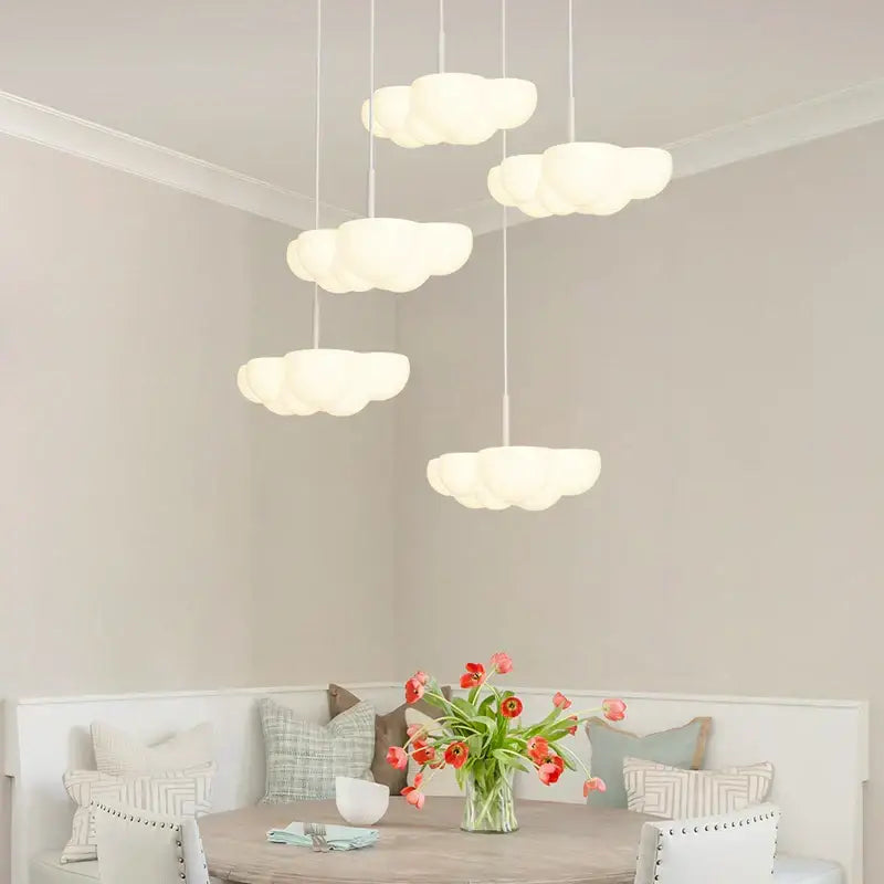 Modern cloud white floating pendant light with white cloud-shaped design hanging in dining room decorbites cloud white