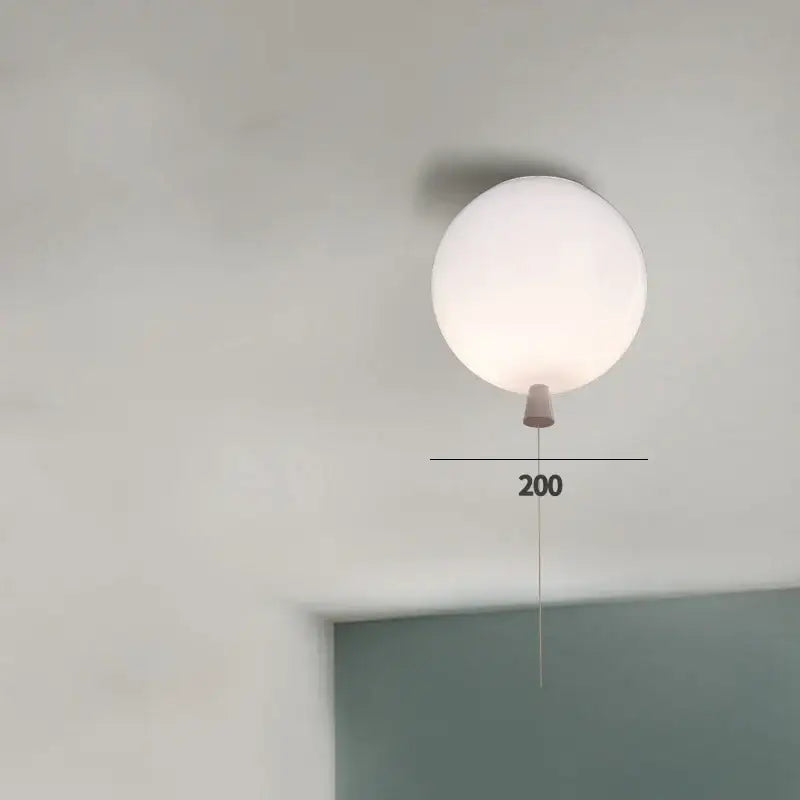 Minimalist white spherical acrylic ceiling light with matte finish and conical base for kids bedroom balloon acrylic ceiling light