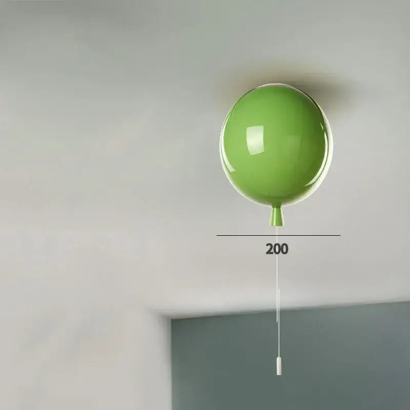 Modern colorful lime green balloon acrylic ceiling light with a glossy finish and white pull cord for kids bedroom