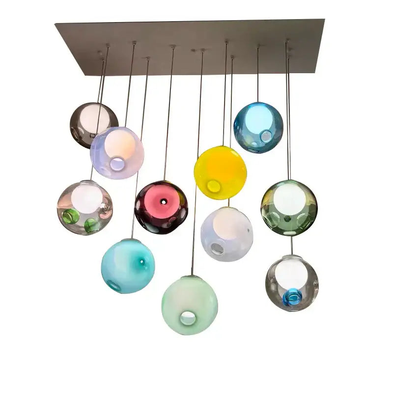 A modern decorbites colorful balls chandelier with a rectangular metal mount and translucent glass spheres pendant light