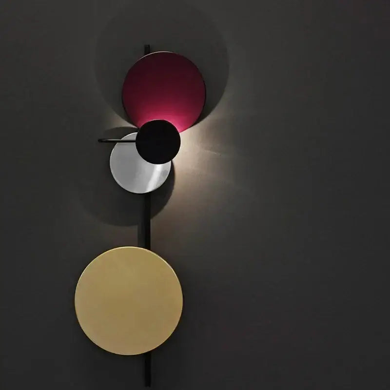 Modern colorful circle metal wall lamp with stacked burgundy, silver, and gold discs for bedroom decorbites colorful circle decor