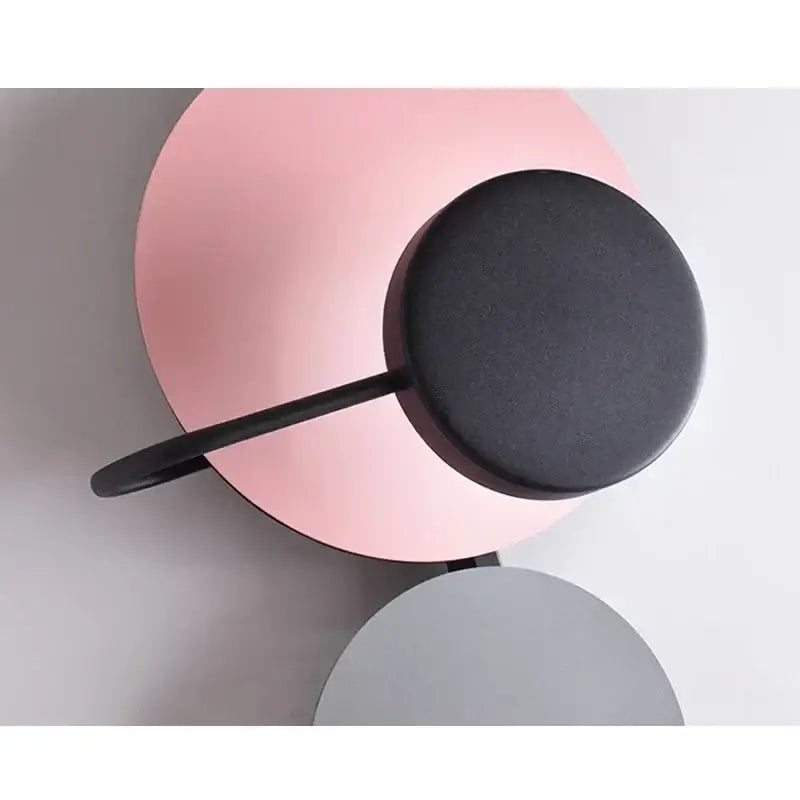 Modern colorful circle metal wall lamp with matte pink base and black cylindrical head for bedroom decorbites colorful circle