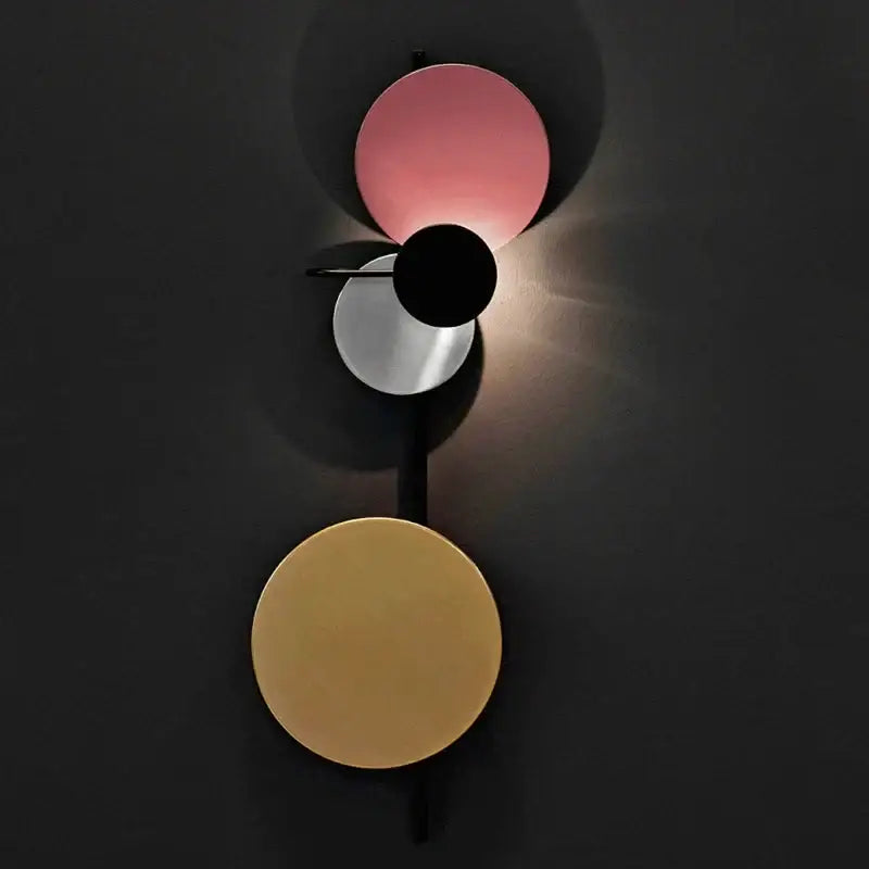 Modern colorful circle metal wall lamp with pink black and gold stacked circular shades for bedroom decorbites decor