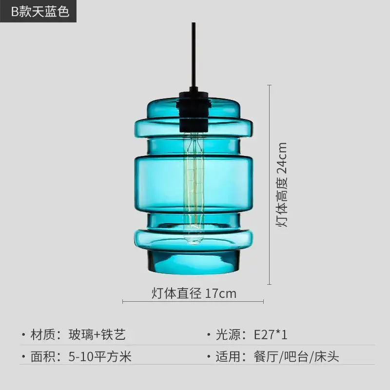 Modern colorful geometric glass pendant light featuring a translucent turquoise tiered glass pendant light with edison bulb by decorbites geometric glass