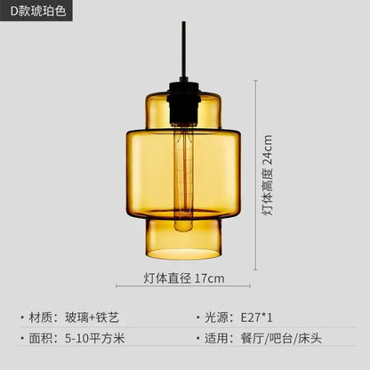 Amber-colored glass pendant light with black metal fixture and exposed filament bulb for modern kitchen lighting decorbites geometric glass