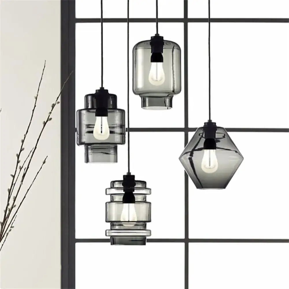 Set of modern pendant lights with black metal fixtures and frosted gray geometric glass shades for kitchen decorbites geometric glass