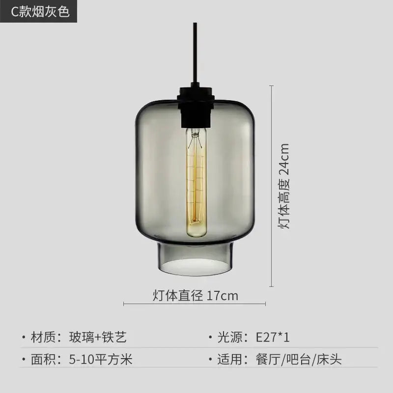 A sleek smoked gray glass pendant light with black metal fixture and exposed edison bulb for kitchen lighting decorbites geometric glass