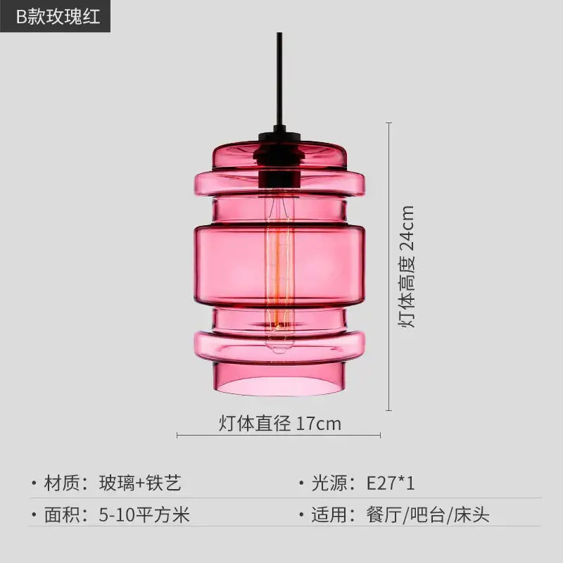 A tiered translucent pink glass pendant light with black metal fixture and exposed Edison bulb by Decorbites geometric glass