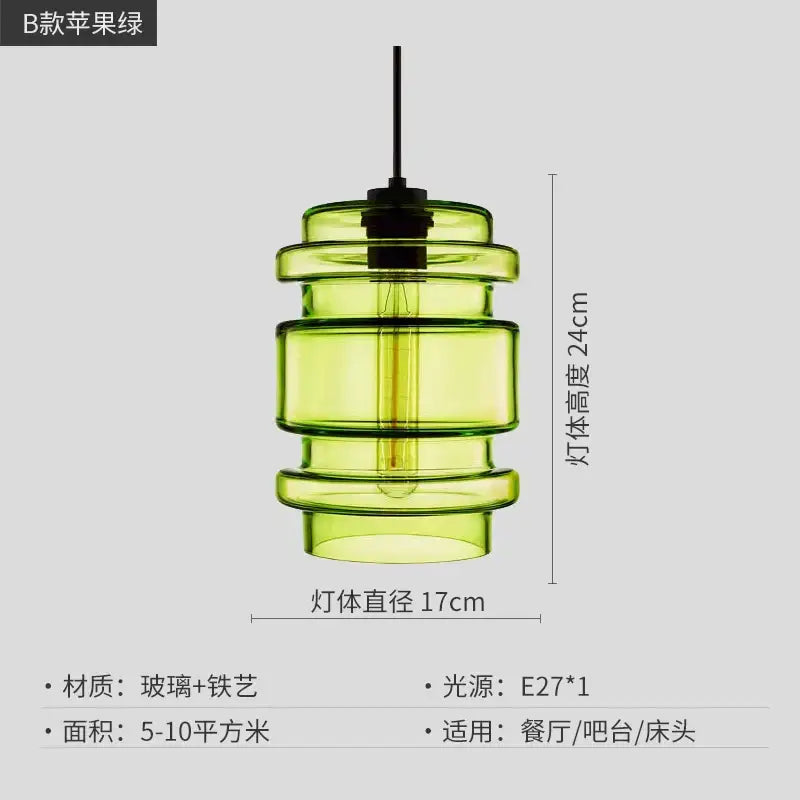 A modern pendant light with tiered translucent apple green glass segments and black metal fixture for kitchen lighting decorbites geometric glass