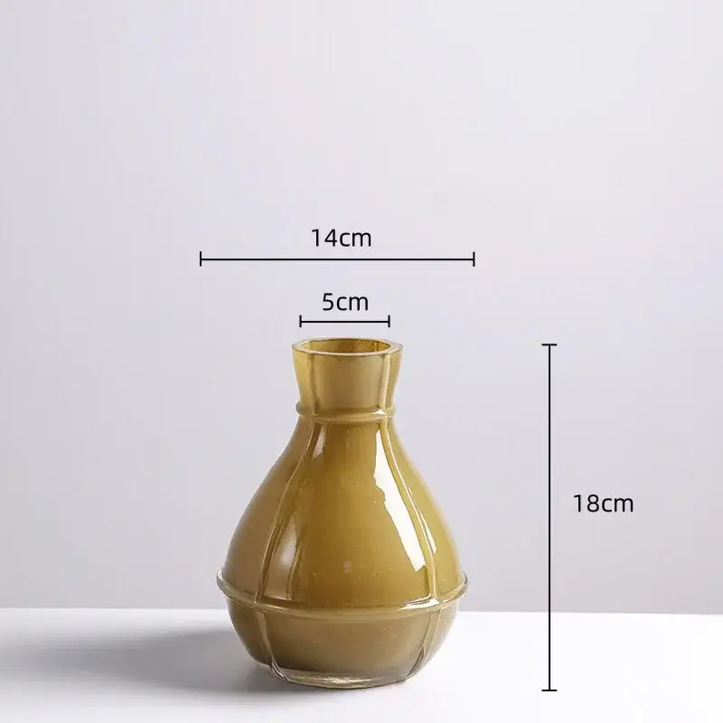 A sleek olive green ceramic vase with glossy finish and geometric ridges in a decorbites colorful geometric glass set