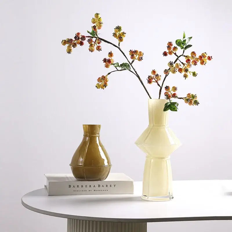Cream-colored ceramic vase with glossy tiered geometric design in decorbites colorful geometric glass vase set