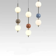 Modern colorful glass ball led pendant light with spherical matte white, gray, terracotta, and blue globes for dining room decorbites