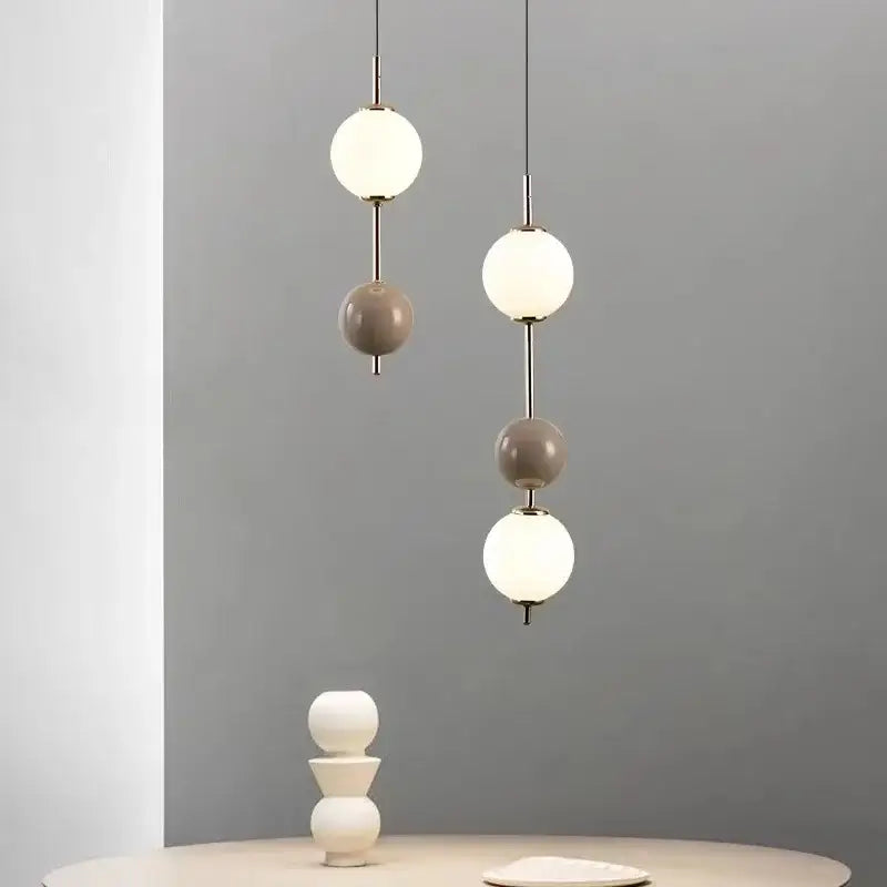 Modern colorful glass ball led pendant light featuring white and matte gray spherical glass shades for dining room decorbites pendant light
