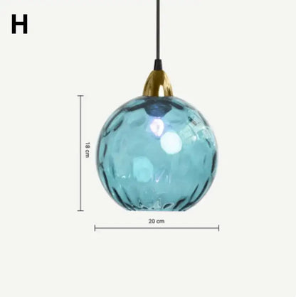 Modern colorful decorbites glass ball lustre pendant lights featuring a spherical blue glass ball with gold fixture