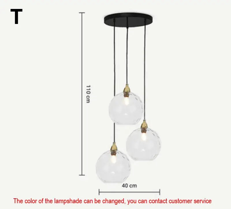 Modern three-light pendant lights with clear faceted glass ball lustre and black metal fixtures for kitchen decorbites