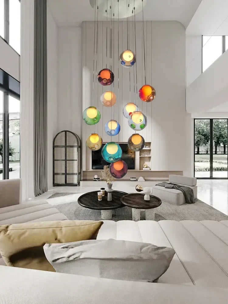 A modern pendant light featuring colorful translucent glass ball orbs by decorbites for dining room decor