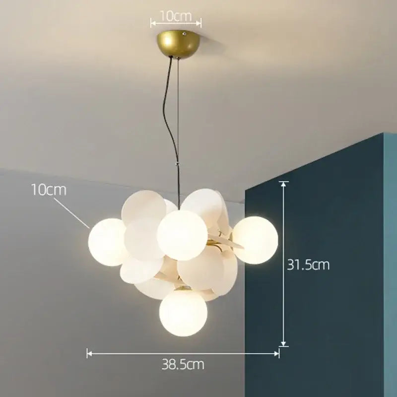 Modern brass-finished decorbites branch chandelier with frosted glass spheres for colorful living room lighting