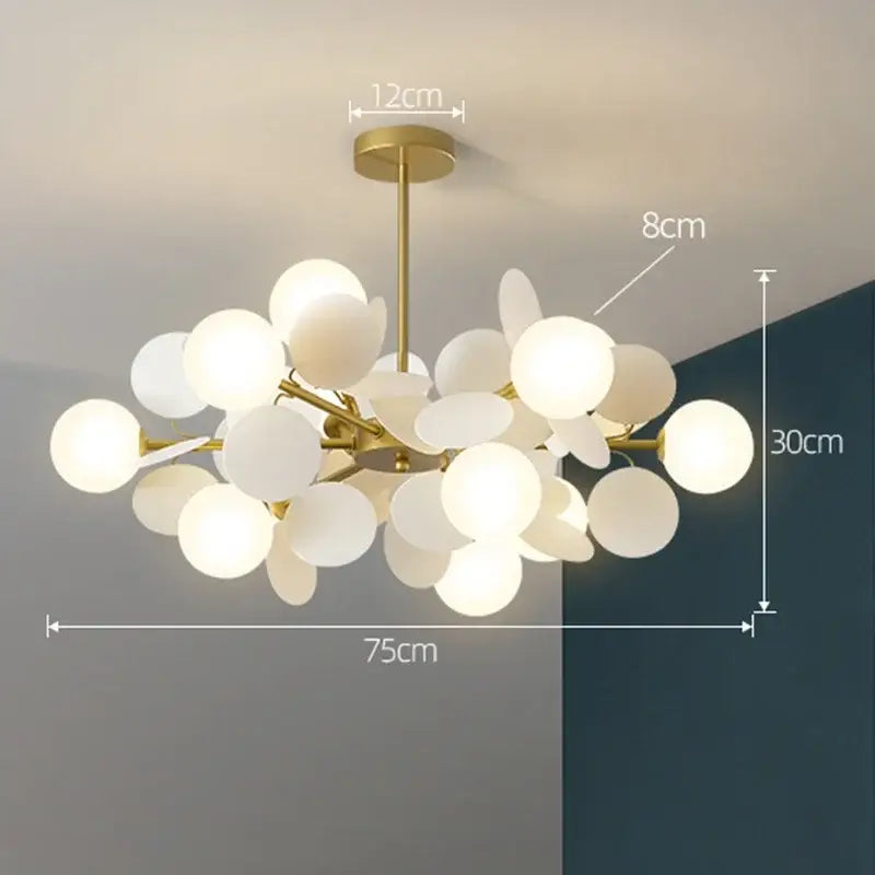 Gold-toned modern decorbites branch chandelier with frosted glass globe shades for stylish living room decor