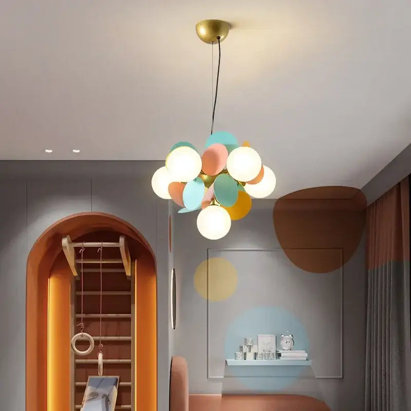 Pastel-colored spherical glass pendant light with brass fixture in modern colorful decorbites branch chandelier for living room