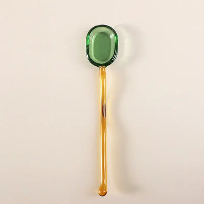 Translucent green glass dessert spoon with long amber handle from decorbites glass dessert spoon set for dining room use