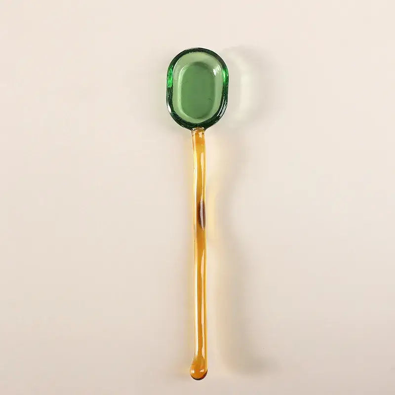 Translucent green glass dessert spoon with long amber handle from decorbites glass dessert spoon set for dining room use