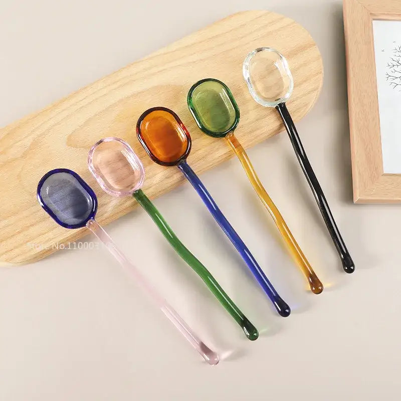 Modern colorful glass dessert spoon set featuring decorbites glass dessert spoons in blue pink amber green and clear hues