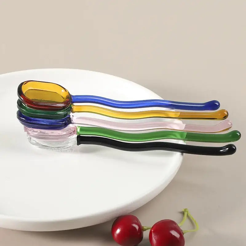 Modern colorful decorbites glass dessert spoon set with five vibrant curved glass spoons for kitchenware use