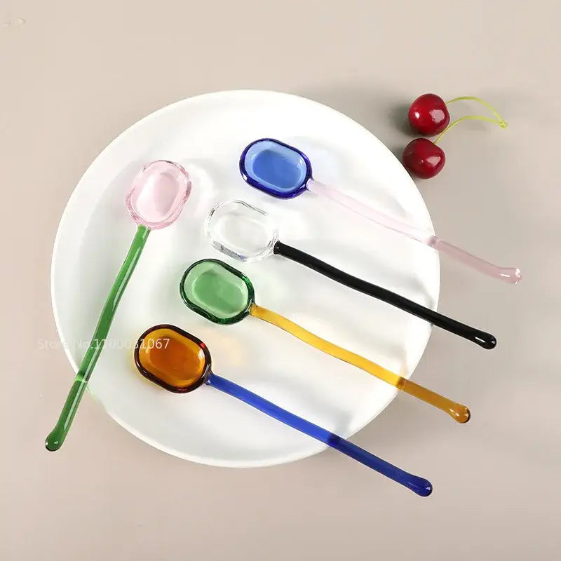 Set of five modern colorful glass dessert spoons in pink blue clear green and amber for decorbites glass dessert use