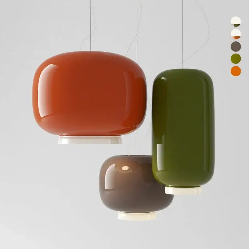 Modern colorful glass pendant lights with glossy orange, olive green, and muted brown glass shades for dining room decorbites colorful glass