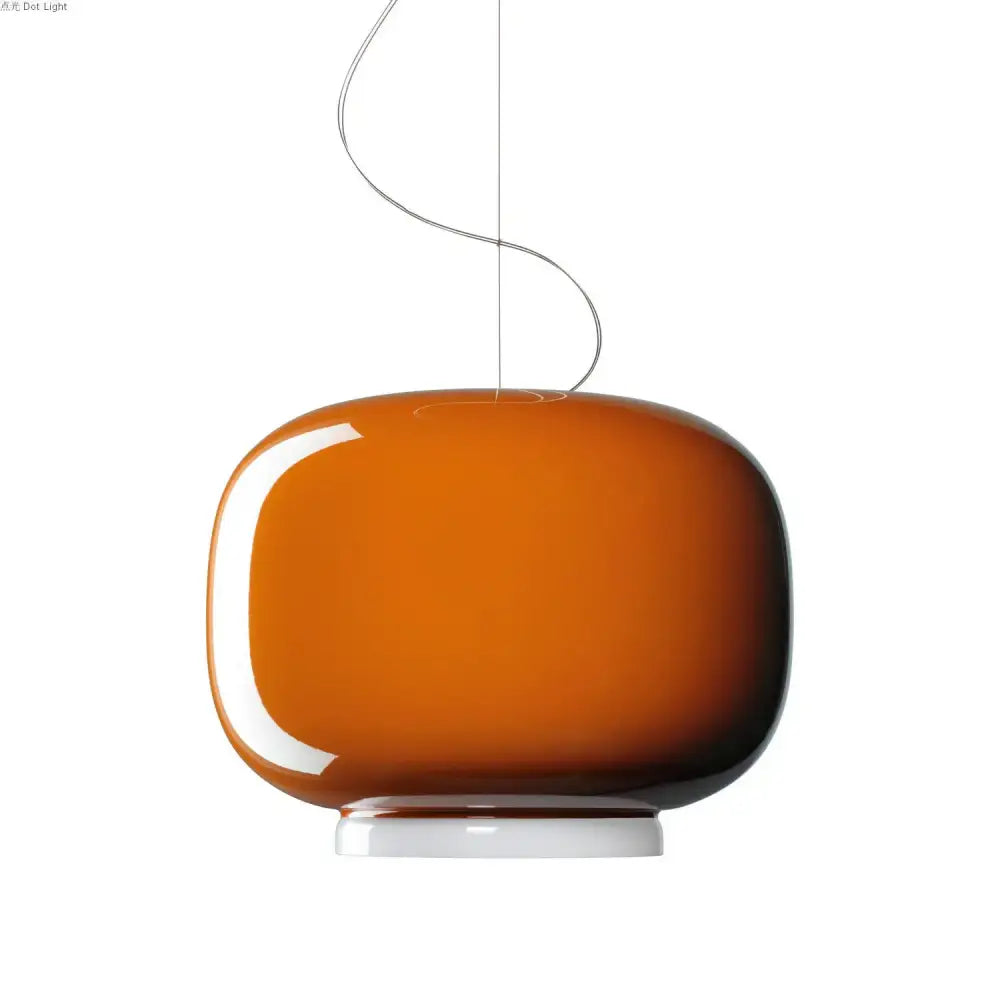 A sleek amber-colored glass pendant light with a smooth rounded body and white base for modern decorbites colorful glass pendant lights