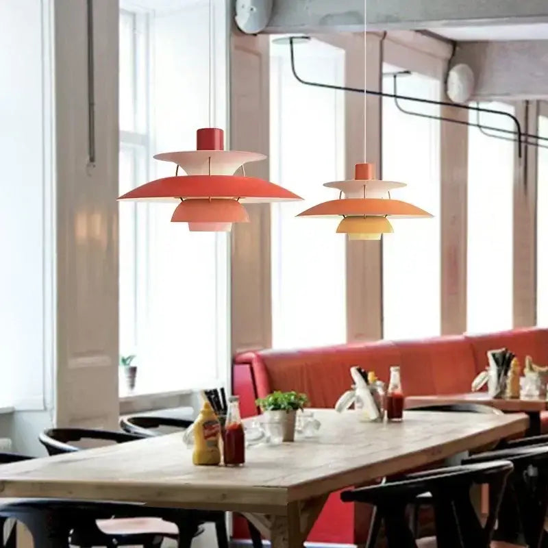 Two coral and peach layered led pendant lights with petal-like shades for modern kitchen and living room use
