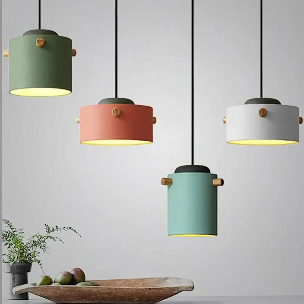 Modern colorful led pendant lights for dining room featuring matte green coral pink white and mint blue shades with wooden knobs