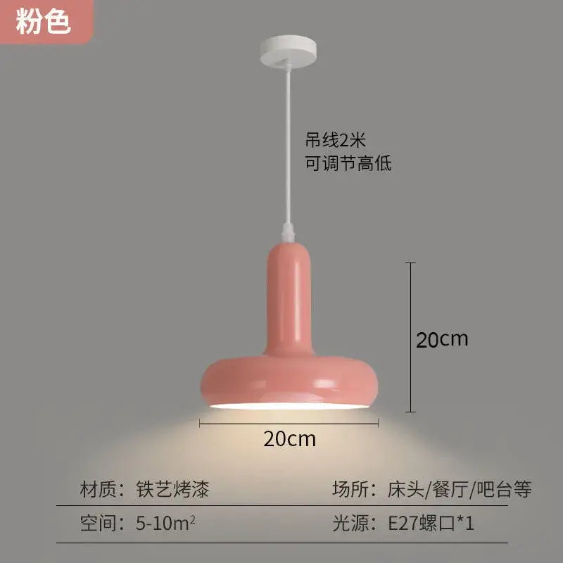 A sleek modern pink pendant light with a glossy painted aluminum finish and cylindrical shade for kitchen dining