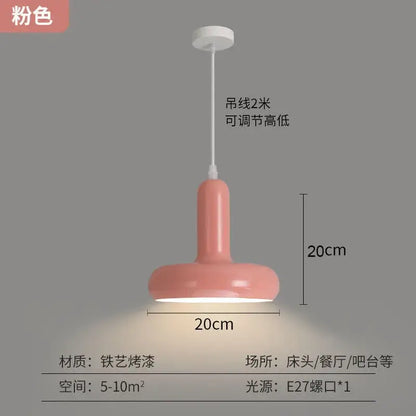 A sleek modern pink pendant light with a glossy painted aluminum finish and cylindrical shade for kitchen dining