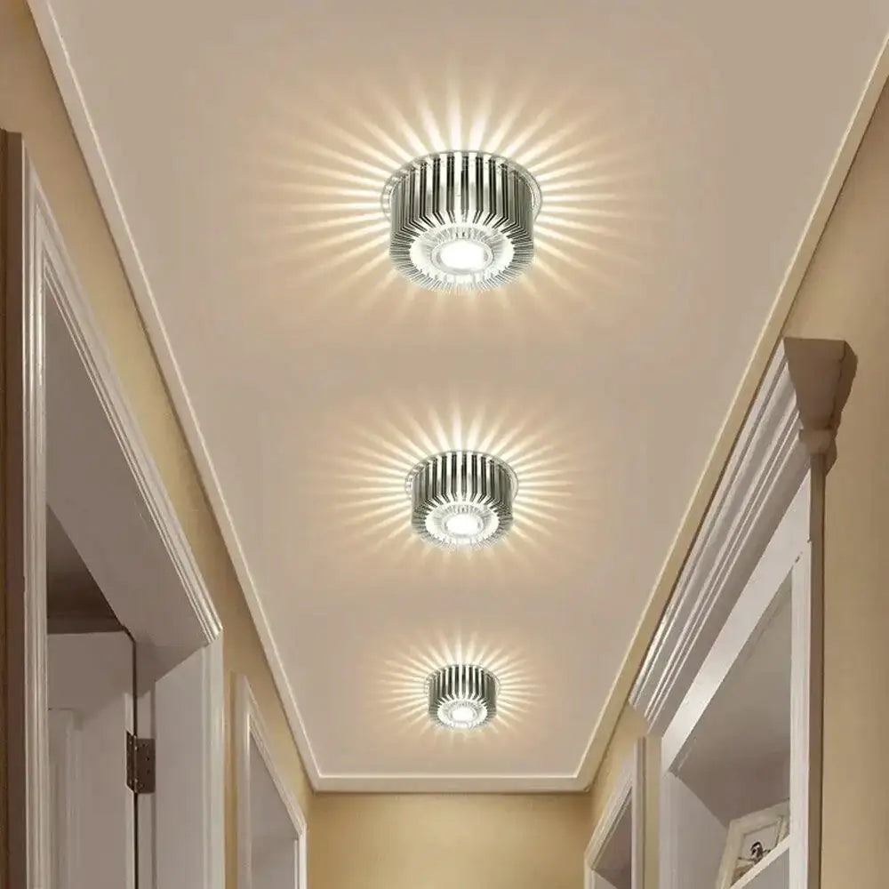 Three metallic modern recessed ceiling lights with radial light patterns for indoor LED decor and gallery lighting