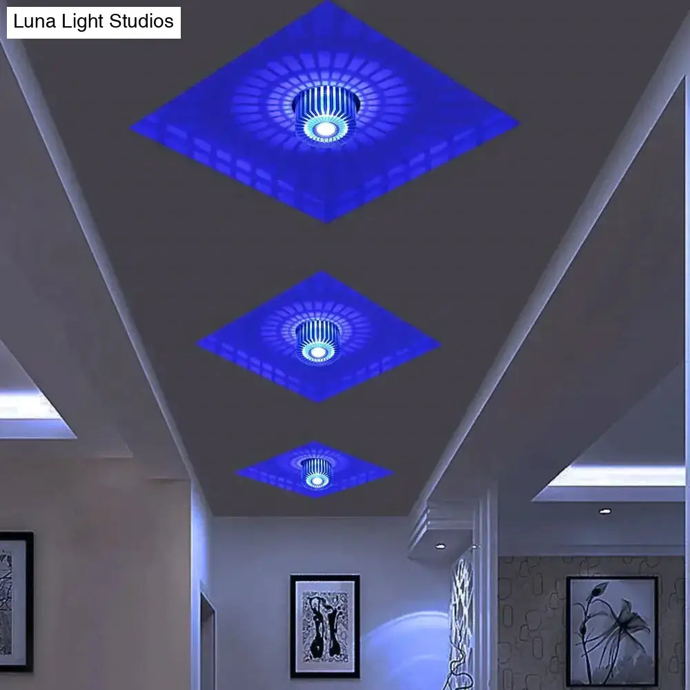Three diamond-shaped blue illuminated modern ceiling lights with central circular fixture for recessed ceiling use
