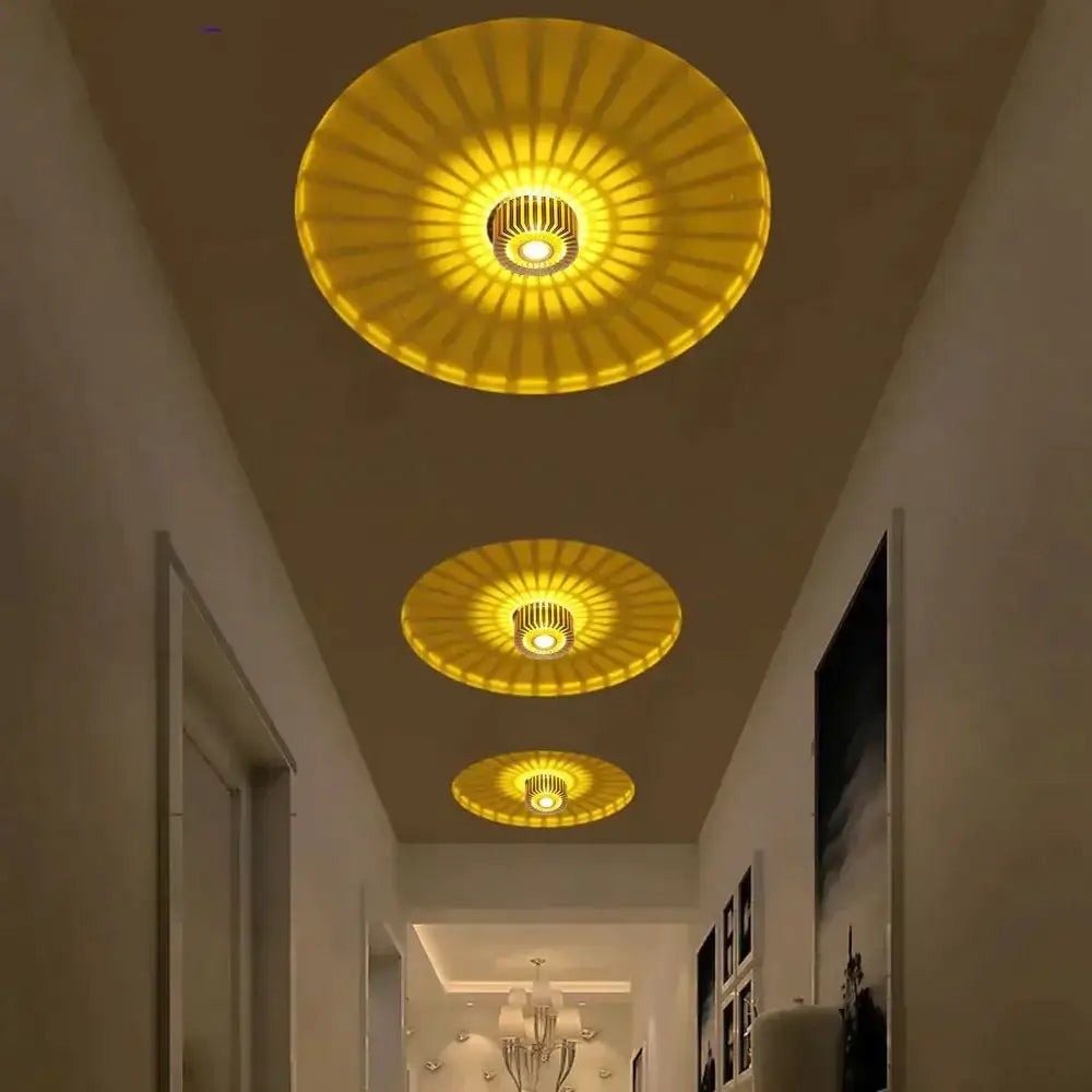 Three golden circular decorbites™ modern ceiling lights with radial spokes and central illuminated fixtures for indoor use